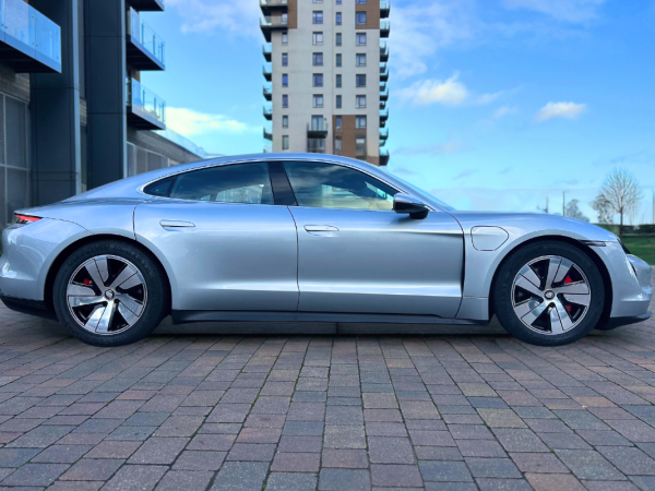 Porsche Taycan in silver facing right