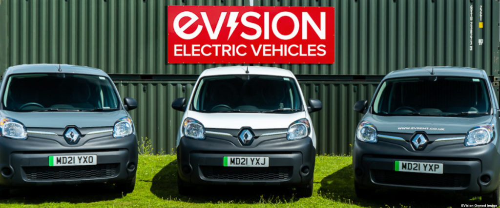 Fleet of Renault Kangoo Vnas in front of EVision Sign